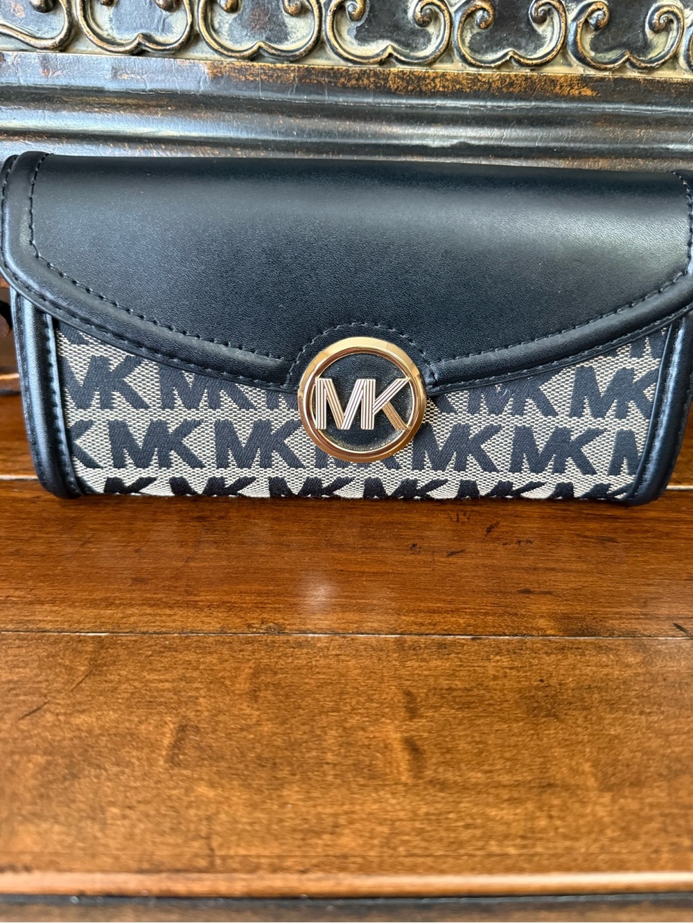 MICHAEL KORS Black and Ivory Logo Clutch with Gold MK Emblem